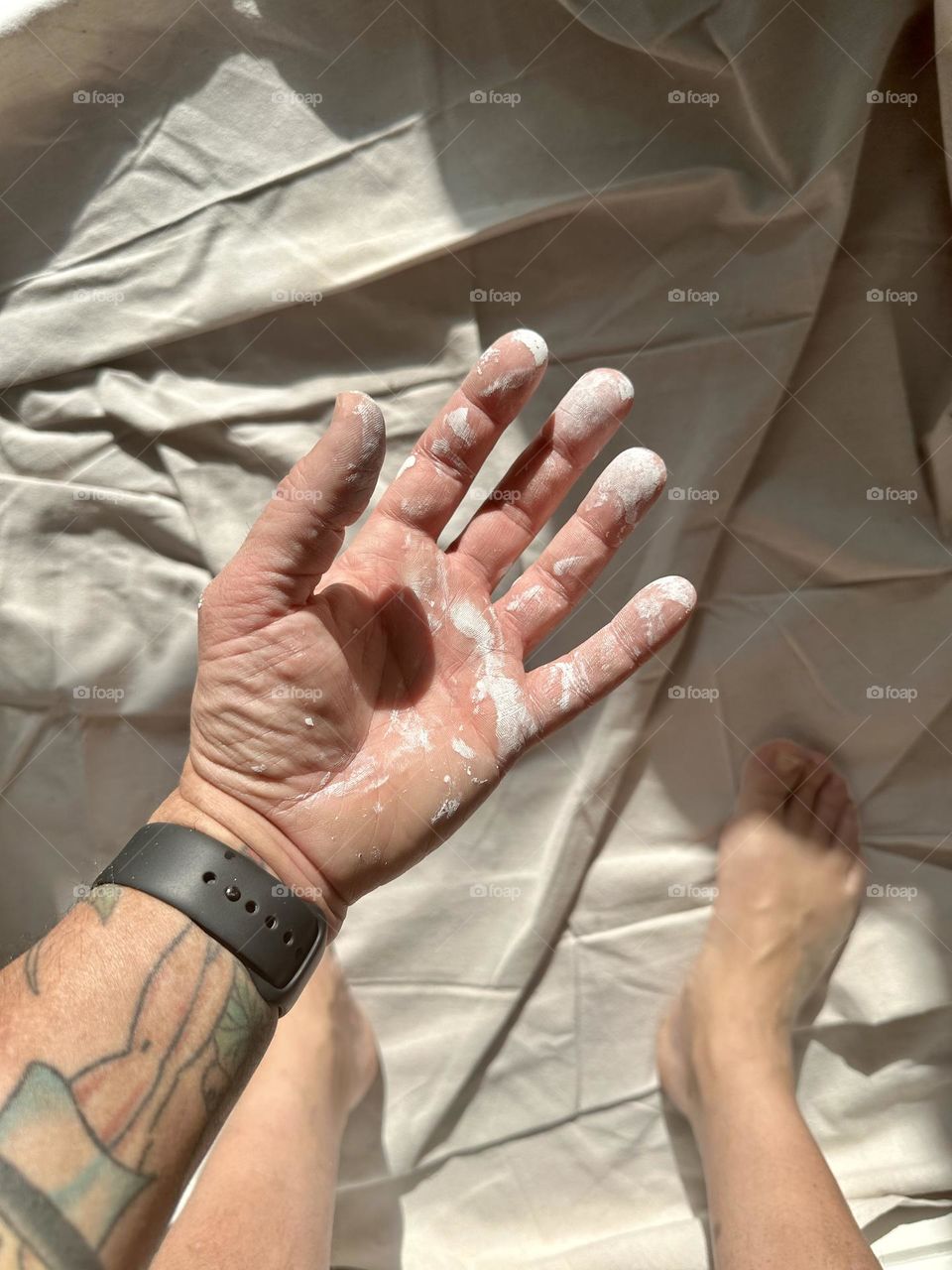 Hand covered in paint, painting at home, home improvement projects, messy painting adventure, paint projects at home, hands getting messy from work, white paint on hand 