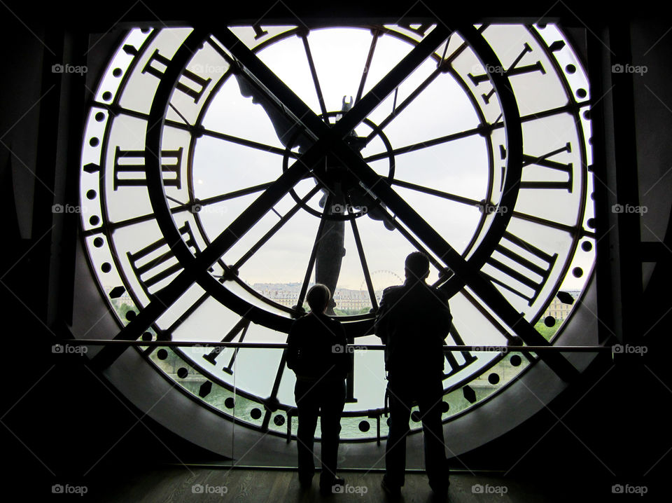 Clock window silhouettes in Paris 