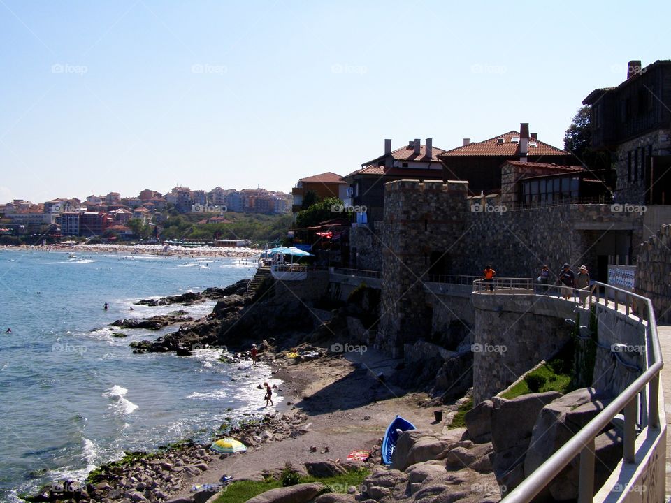 Sea coast with buildings on rocks 