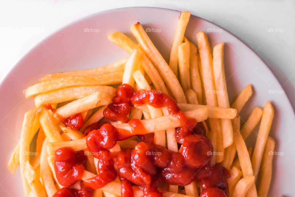 French Fries Potatoes With Red Sauce On Plate
