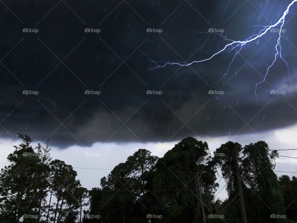 Dark clouds , lightning and raindrops.