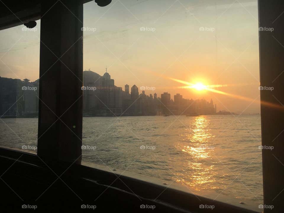 Hong Kong. Sunset on ferry back from Kowloon to HK. Lights, energy, life, culture, history, tradition, excitement, adventure, hidden gems 