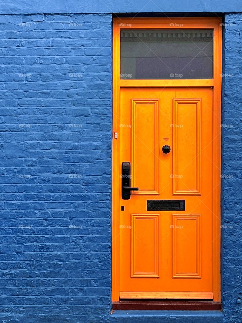 Orange door, blue wall