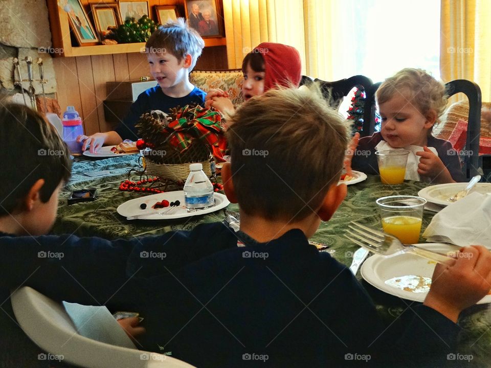 Children At Family Dinner Table
