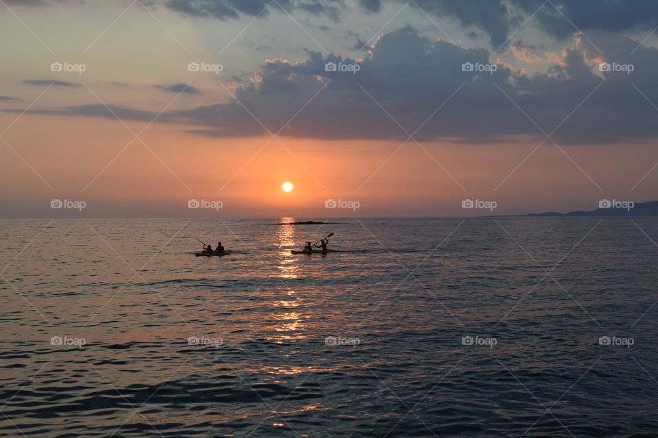 Greece summer sunset canoeing. Greece summer sunset canoeing