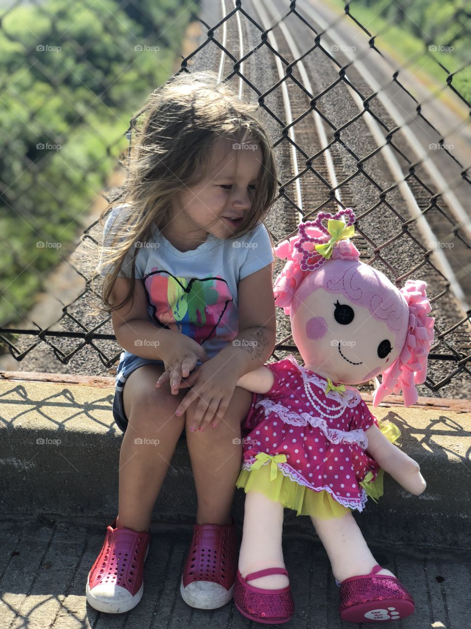 Train spotting with Willow and her dolly