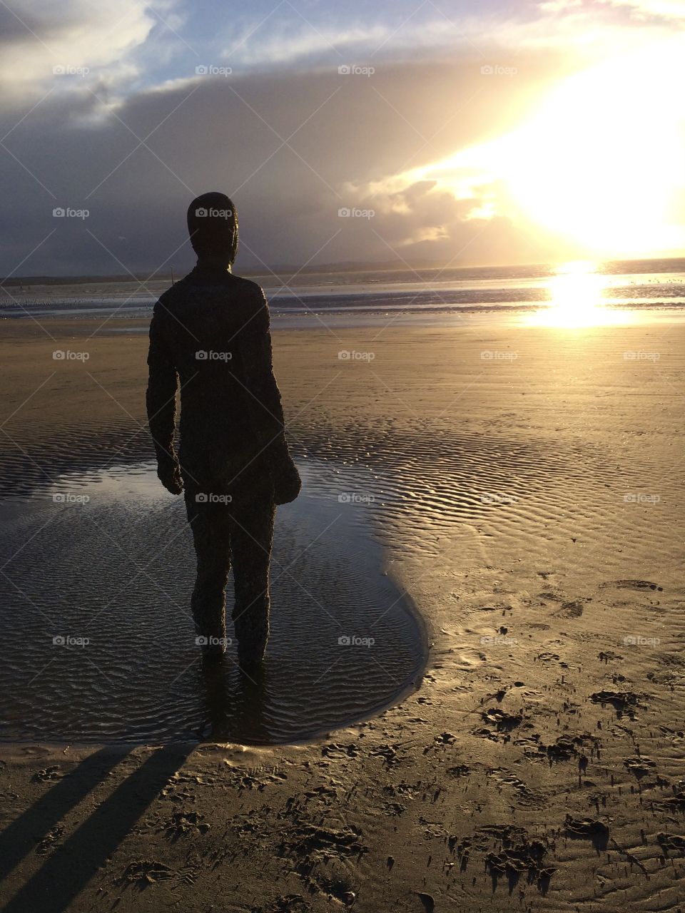 The sea watchers at sunset