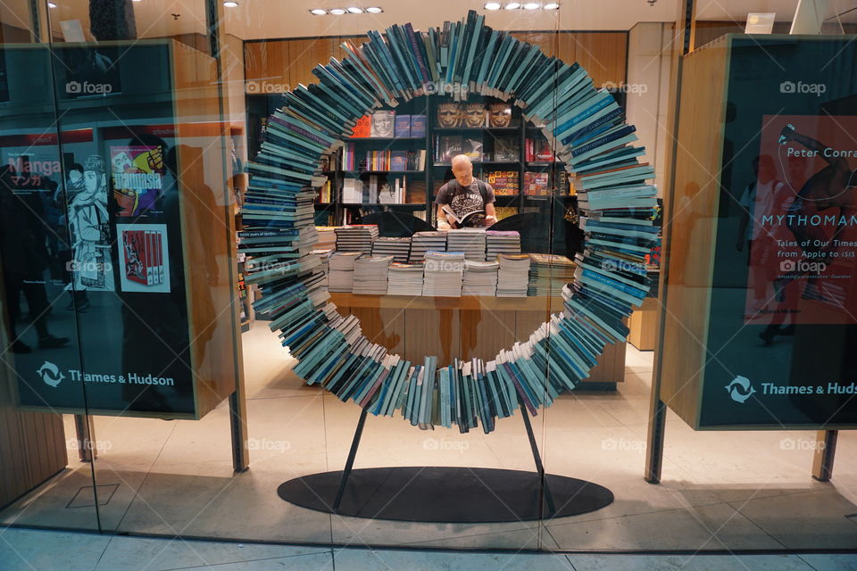 Books arranged artistically into a self supporting circle 