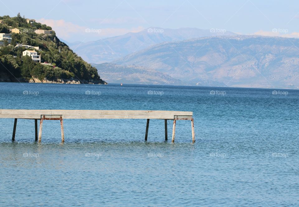 A pier over blue sea