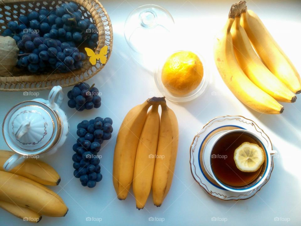 Fruits and tea on white background