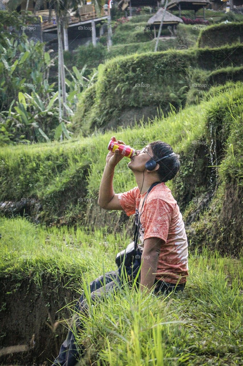 CocaCola on the green field after climbed down the mountain