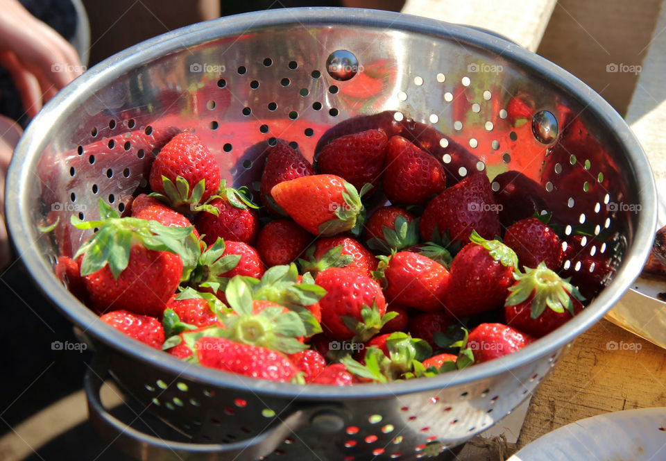 Strawberries in a metalic bowl