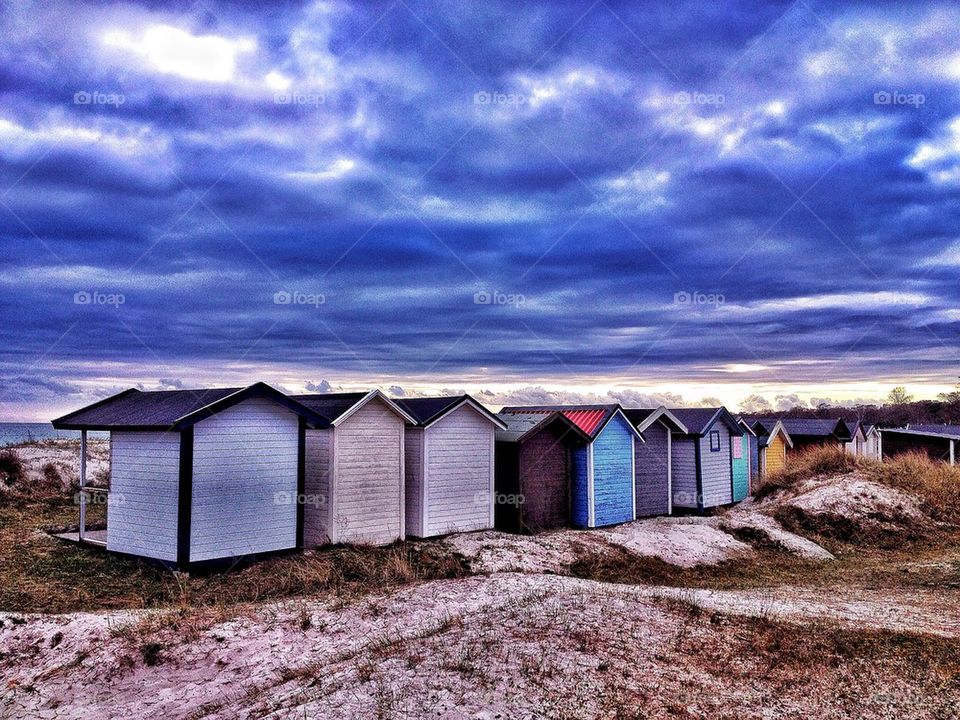 Beach huts awaiting rain