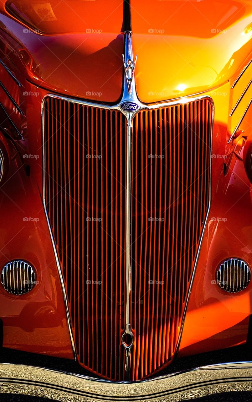 Bright Ford Classic Car Hood And Grill Front End At A Car Show 