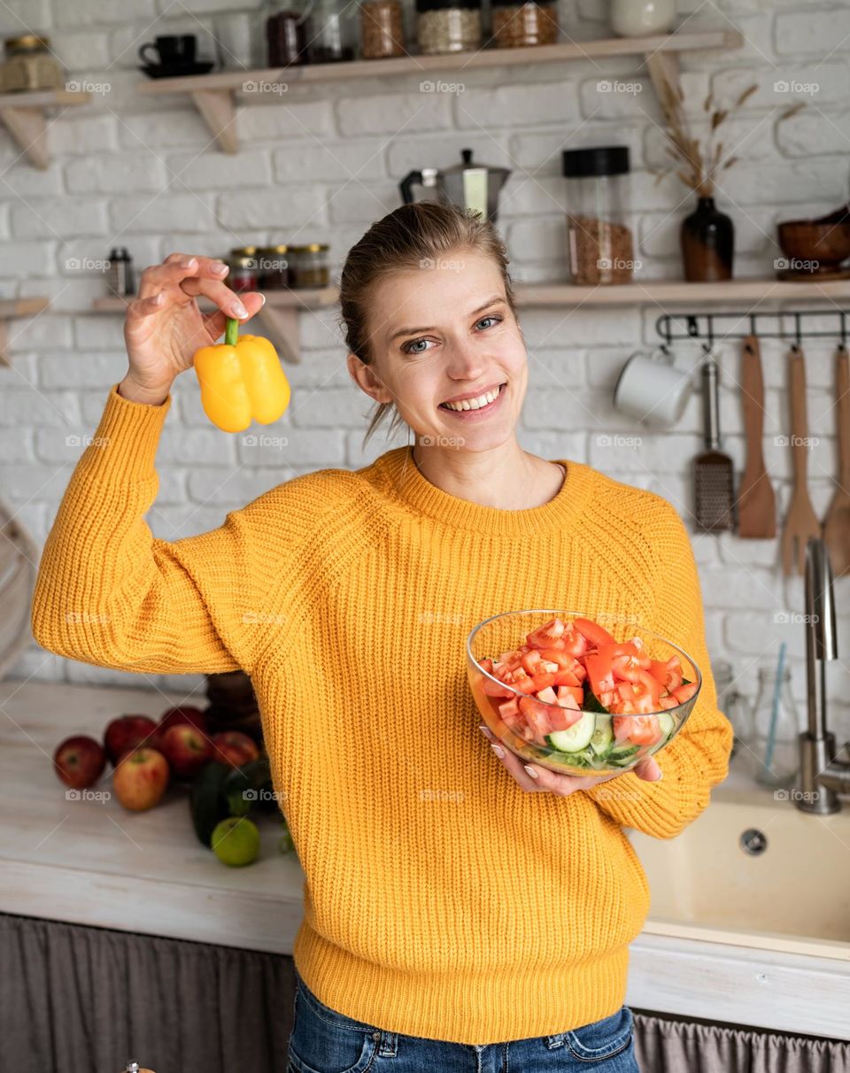 woman making vegetables salad