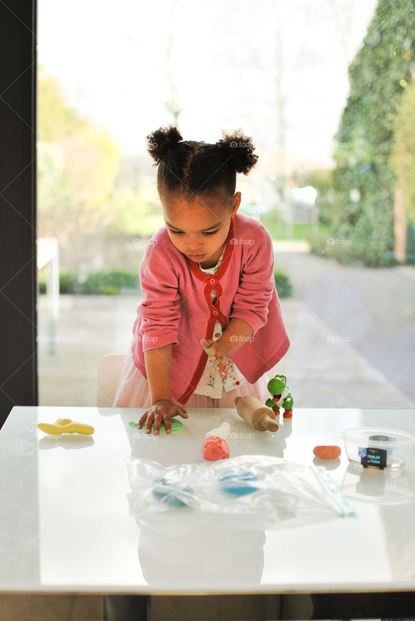 Little girl of mixed race crafting