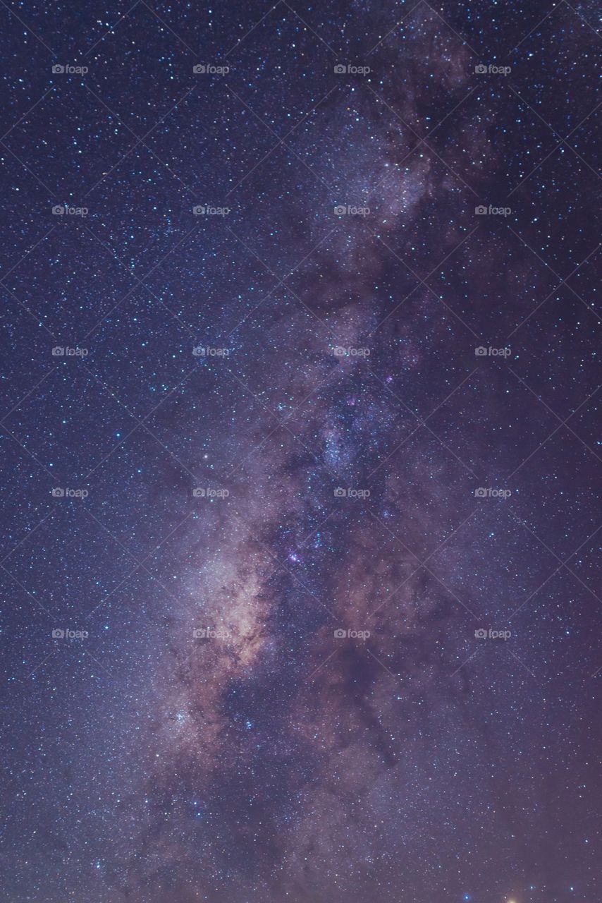 Milky way galaxy with stars and space dust in the universe, Long exposure photograph, with grain