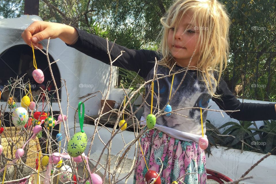 Girl doing Easter decorations