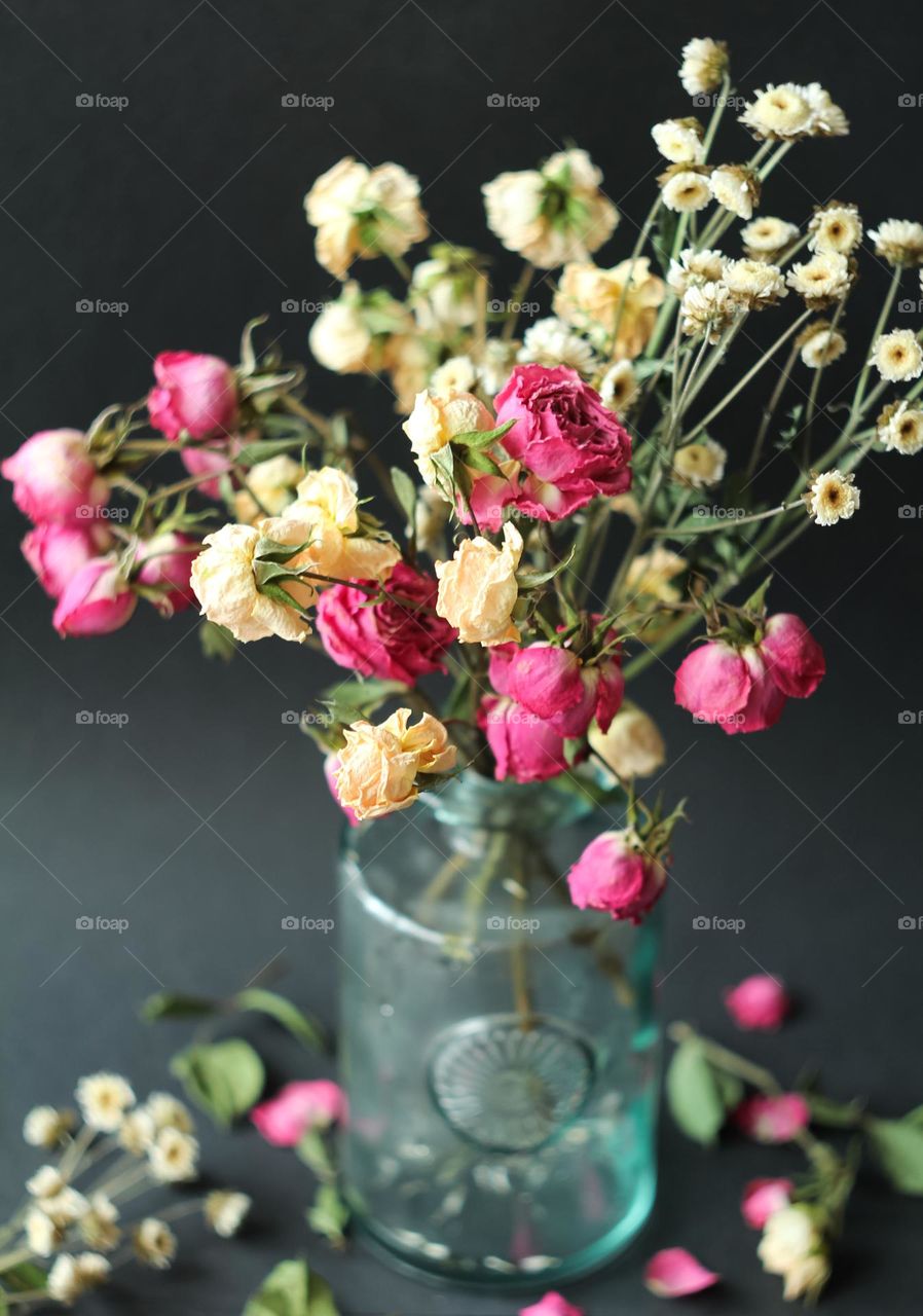 A bouquet of dried flowers in a vase