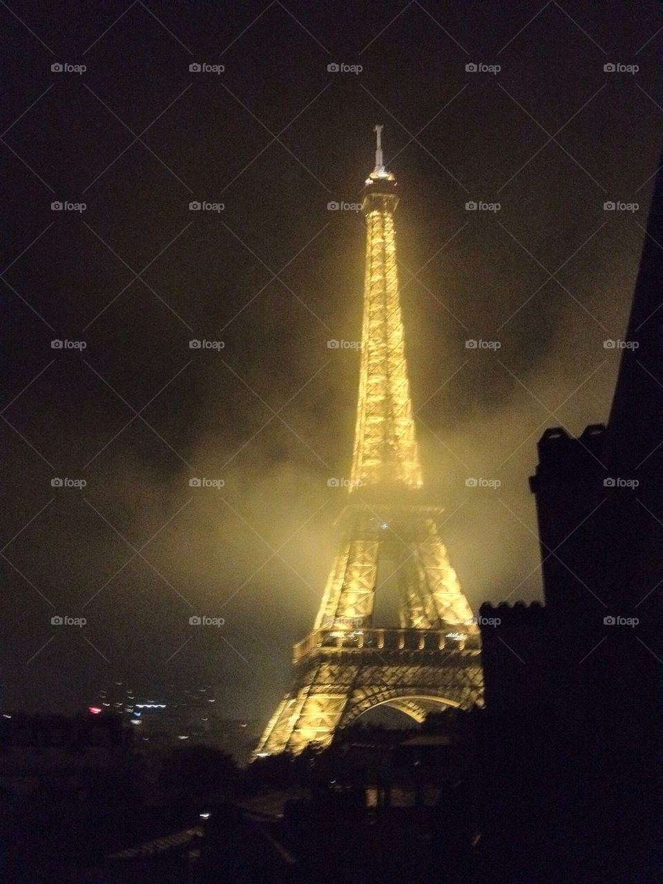 Eiffel Tower through fog