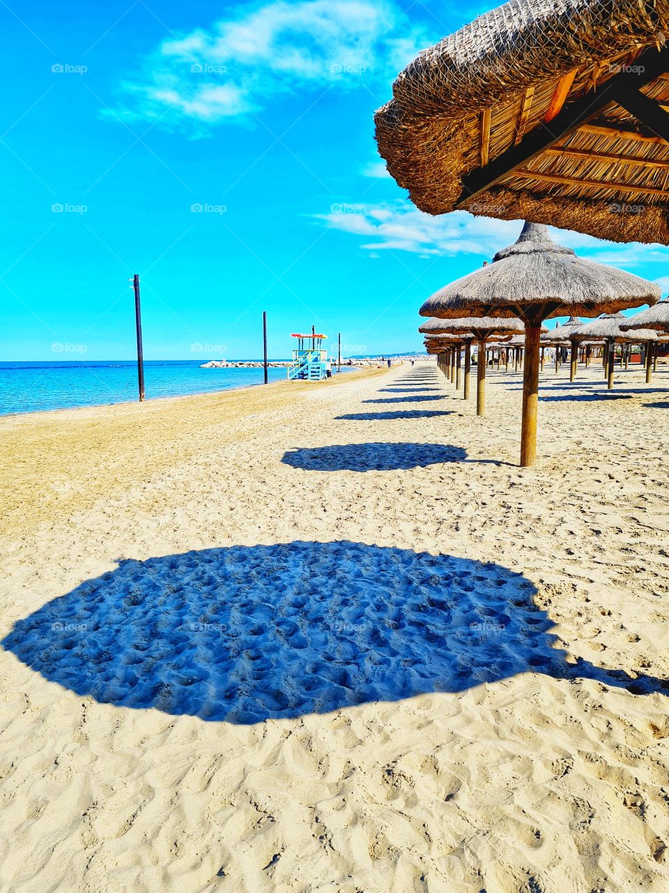 shadows of beach umbrellas