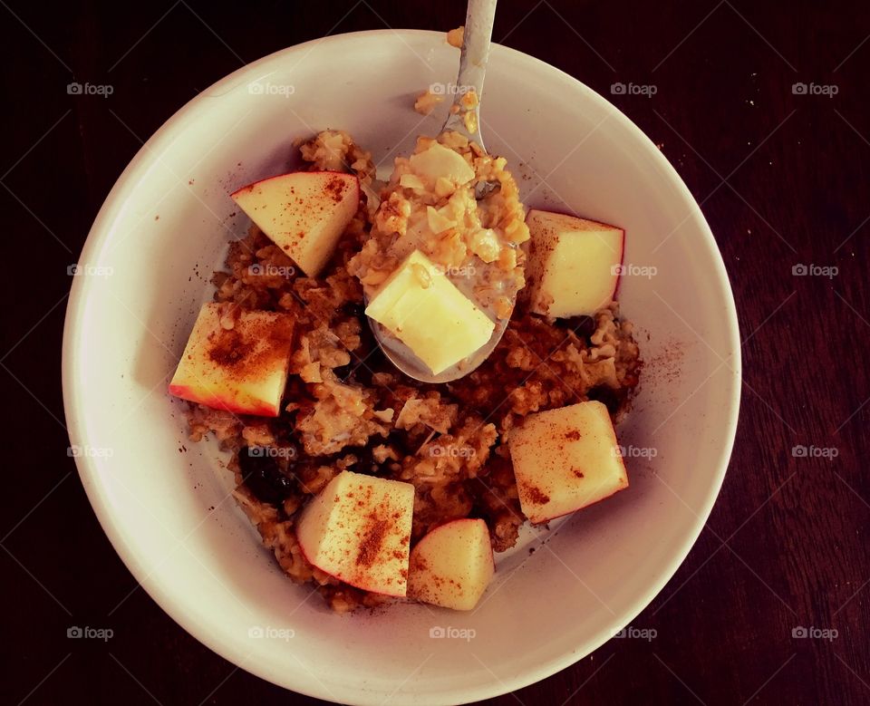 Eating steel cut oatmeal with milk.