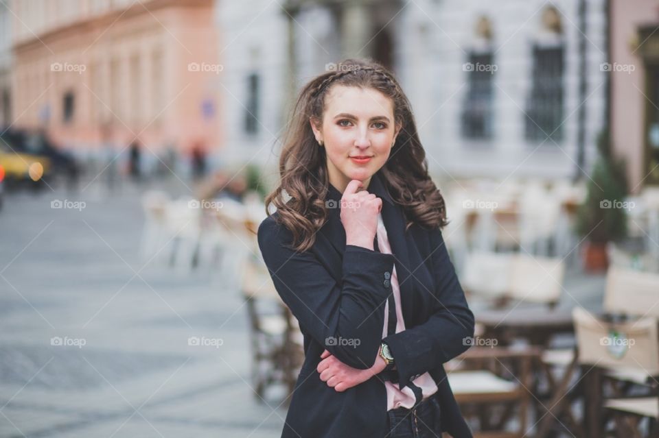 Serious girl portrait on a windy day