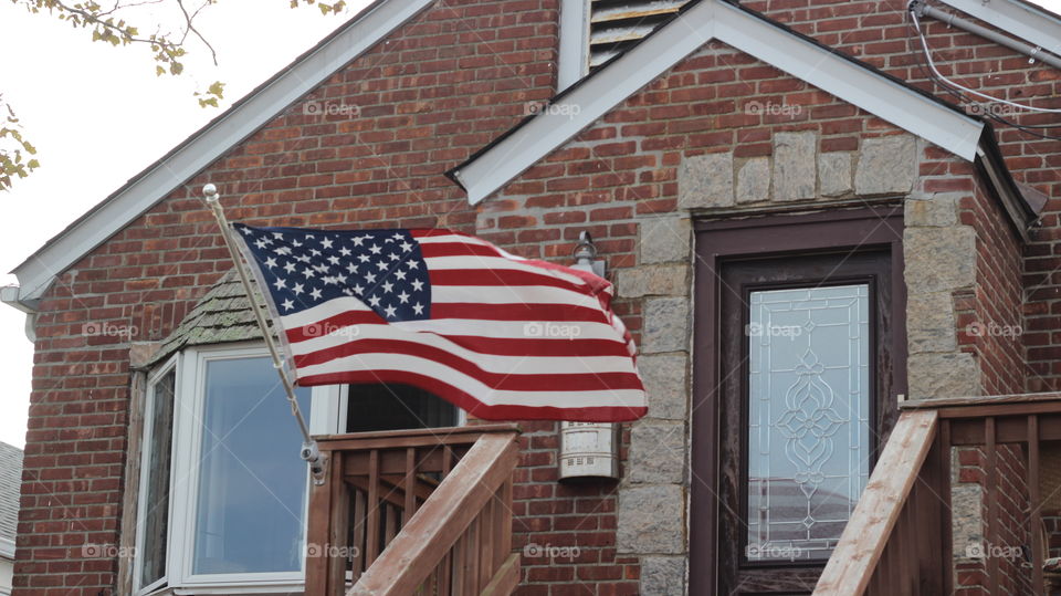 All American Town. An American flag outside a home in the suburban beach area of Long Island