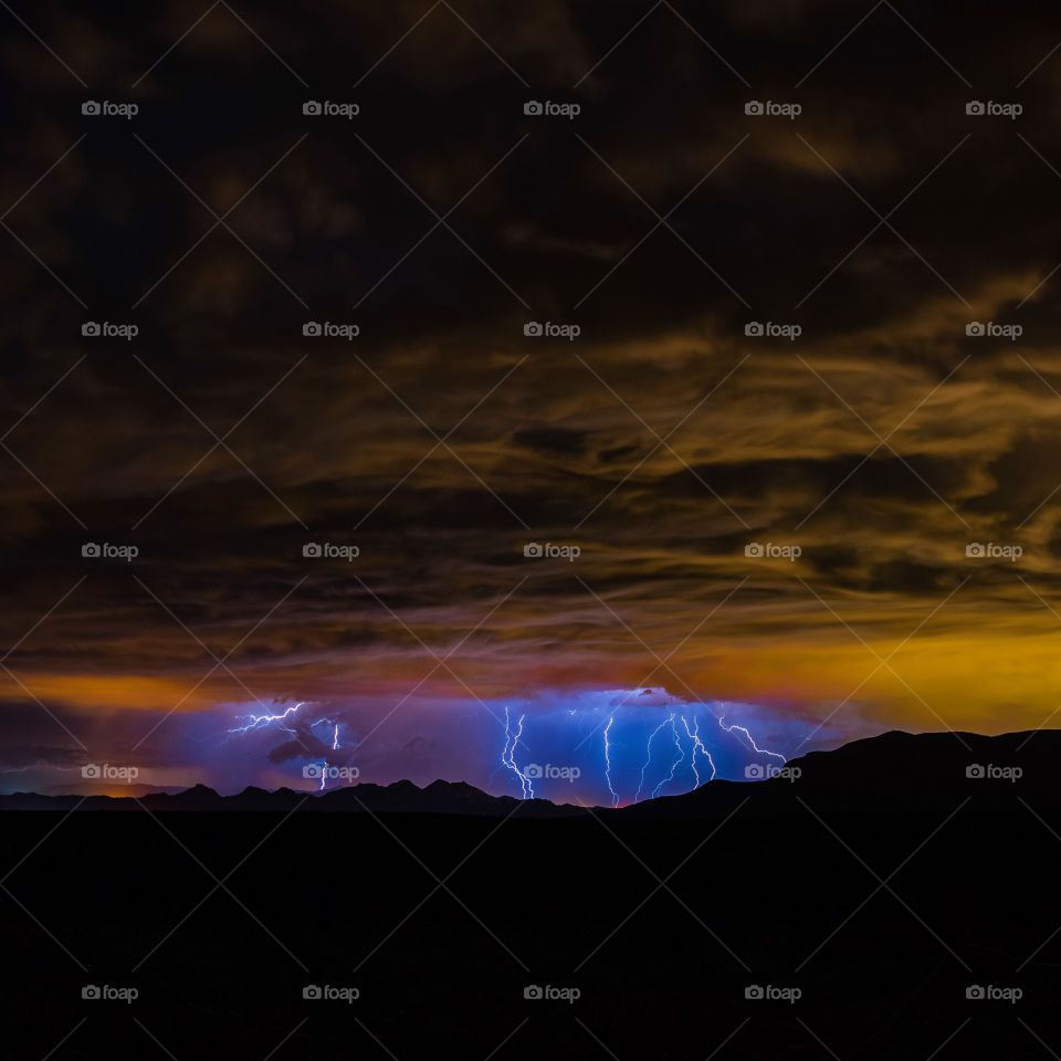Lightning strikes over the desert at night