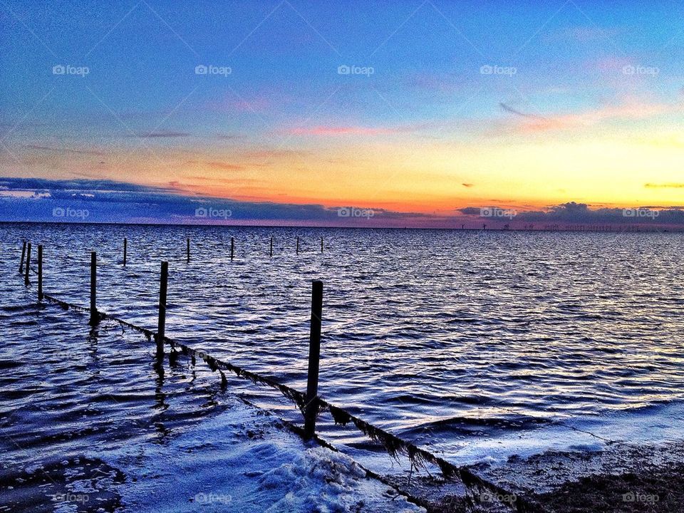 Barbed wire in sunset