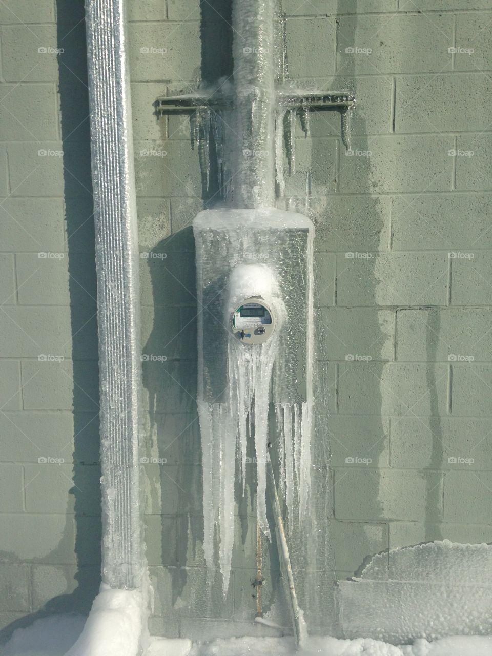Nature vs Technology. Ice takes over an electric meter 