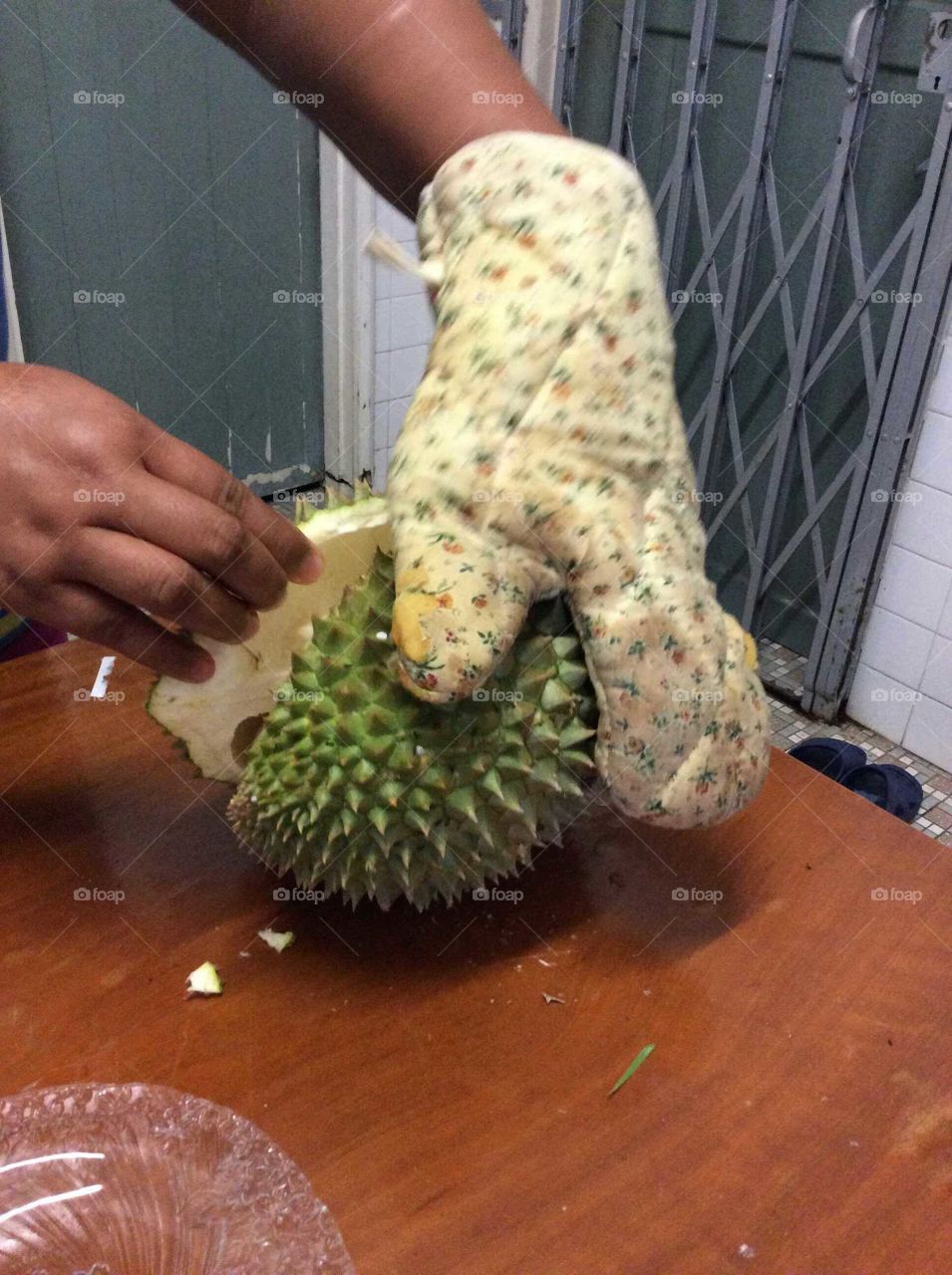 Opening a durian fruit