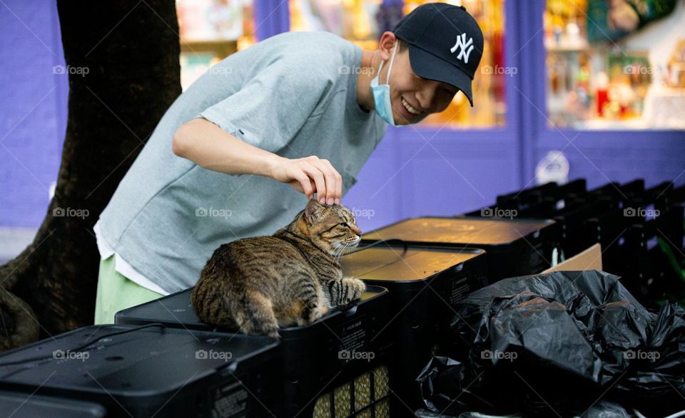 An affectionate person loving a cat