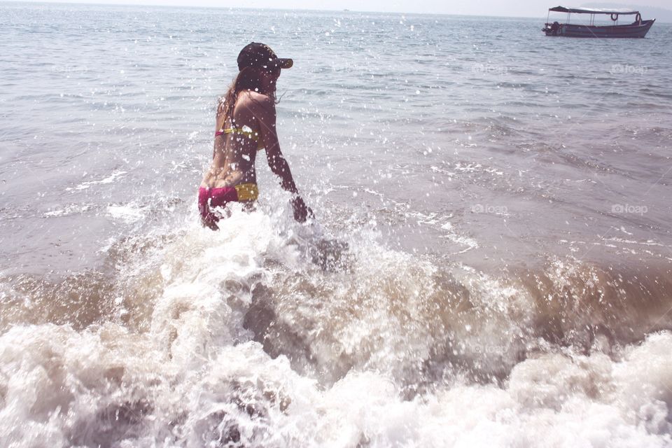 girl is swimming in the sea