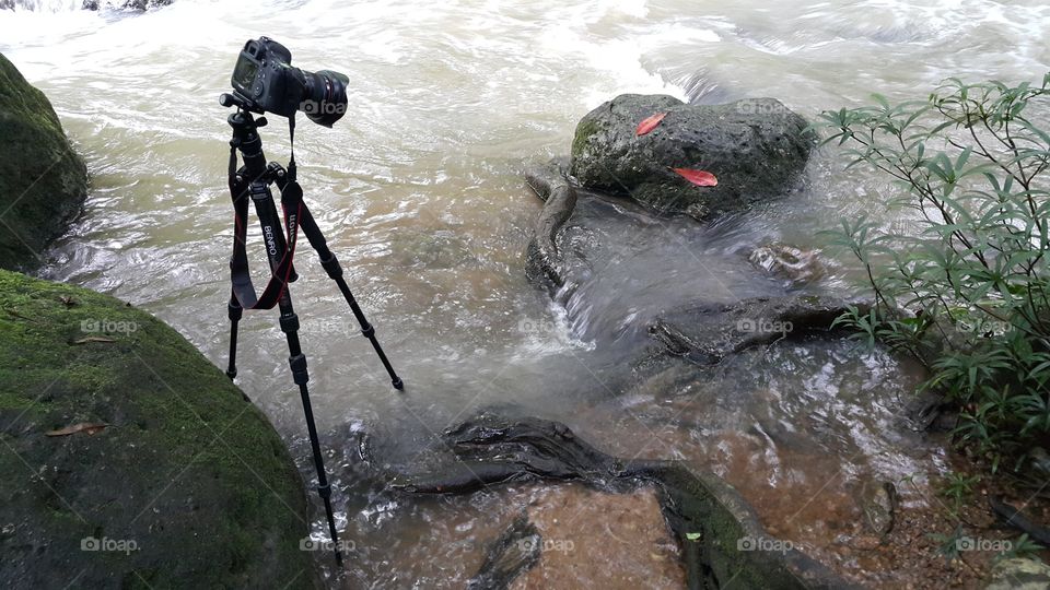 on location shooting long exposure river flowing