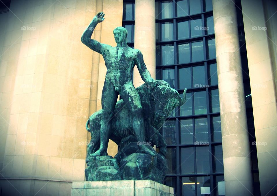 Man and bull statue in Paris France