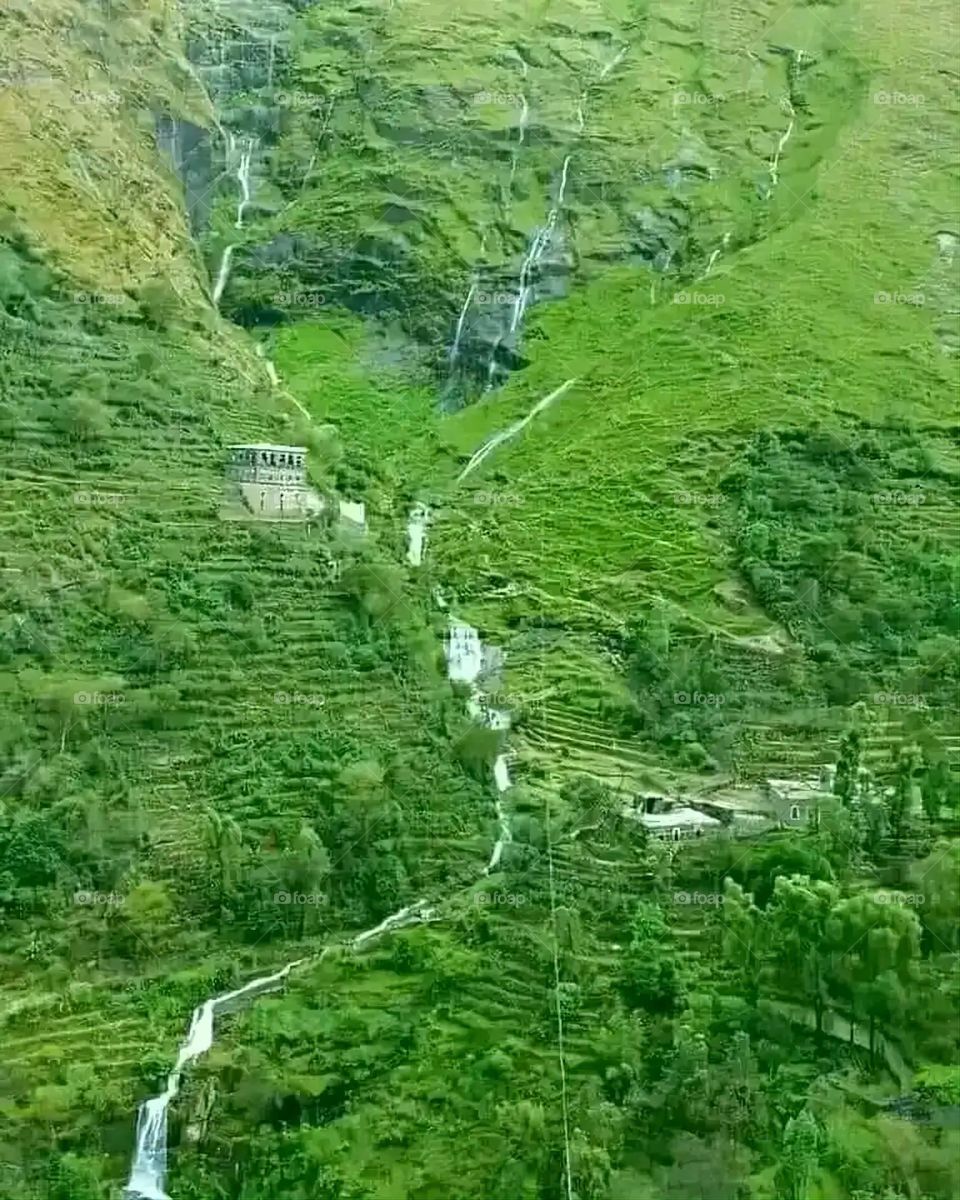 Glory be to God, the magnificent and picturesque view and the natural green trees are a view that is nothing more wonderful than it