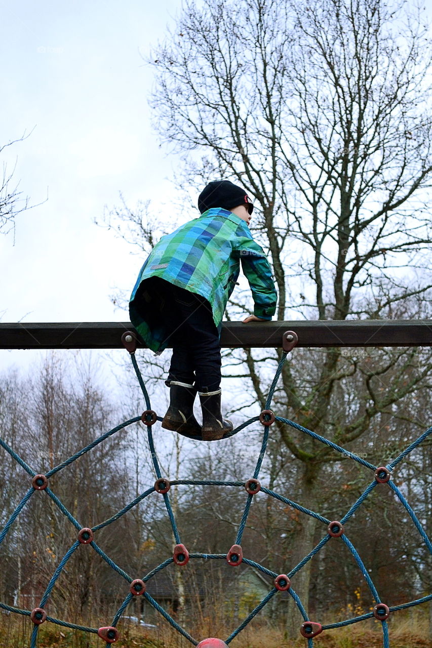 Boy playing at the playground