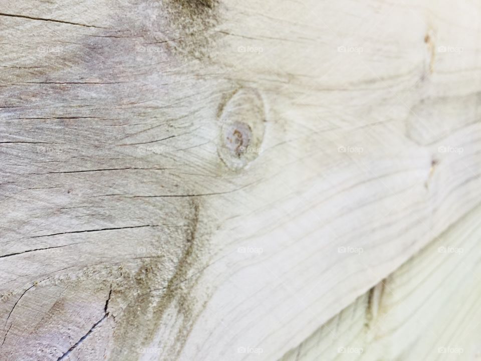 This is a picture of wood close up. The wood has swirls in it. There are two panels of wood.