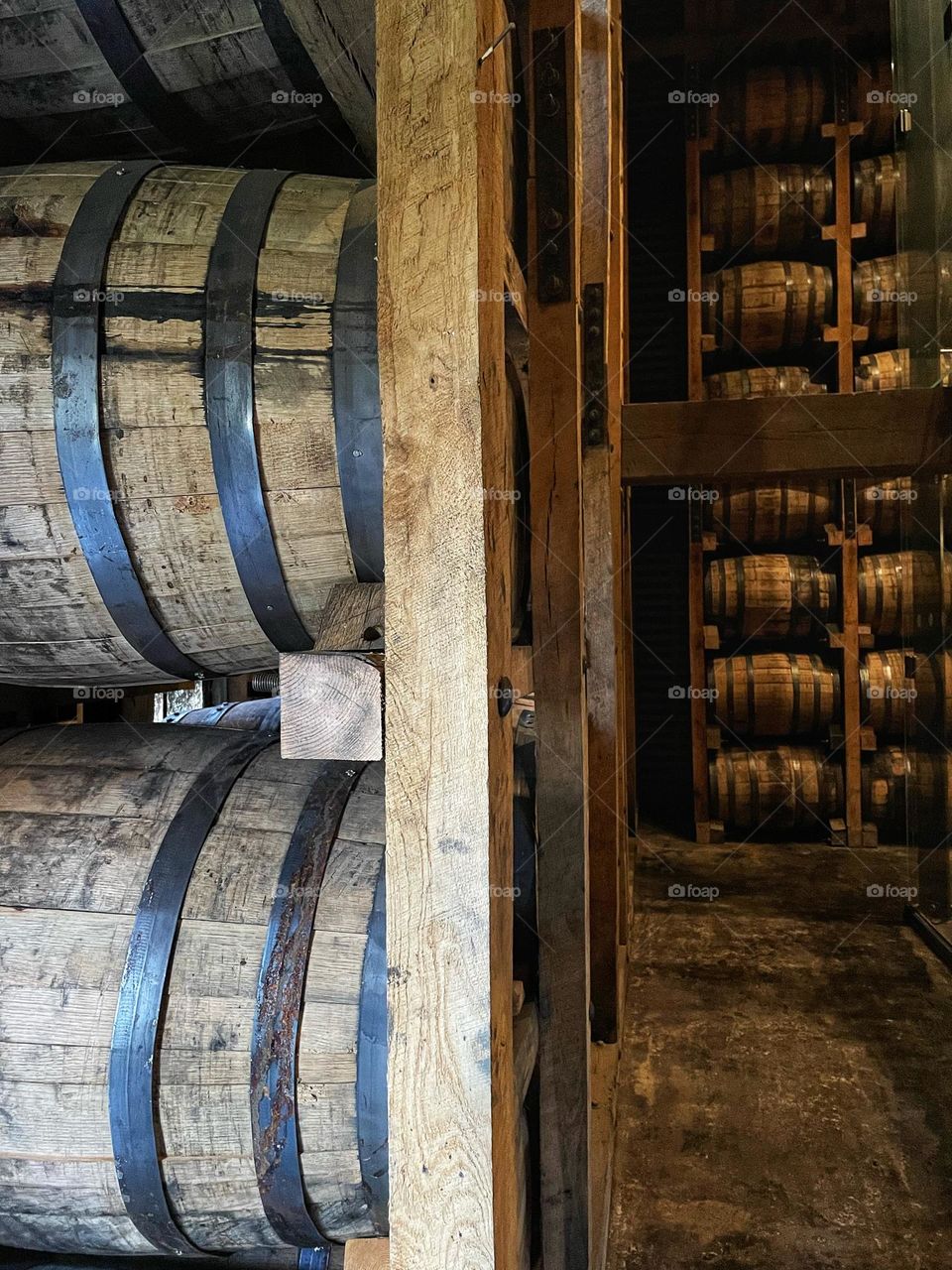 Bourbon whiskey barrels at rest in Jack Daniel’s distillery