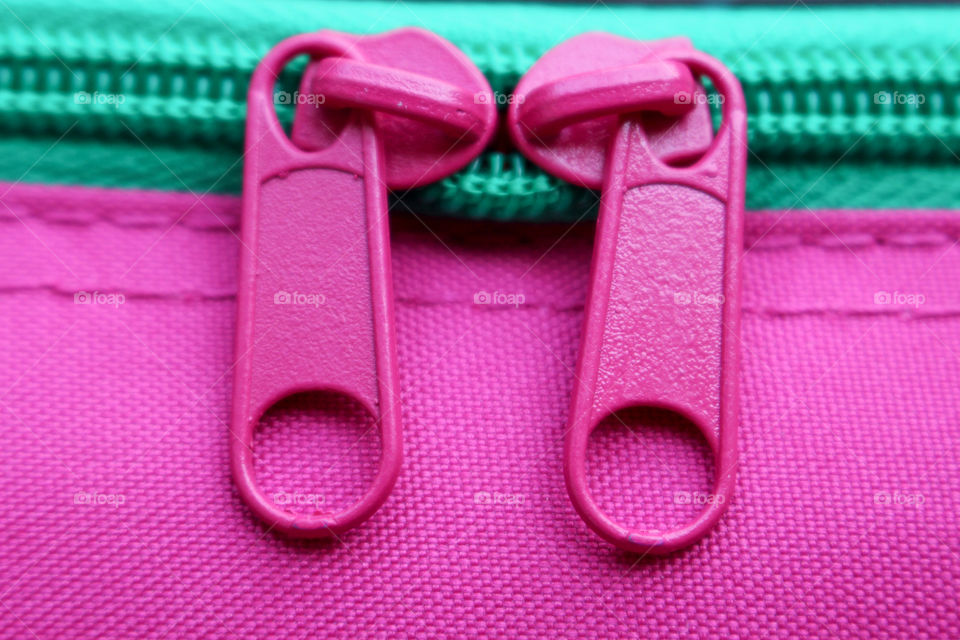 Close-up view of pink zipper