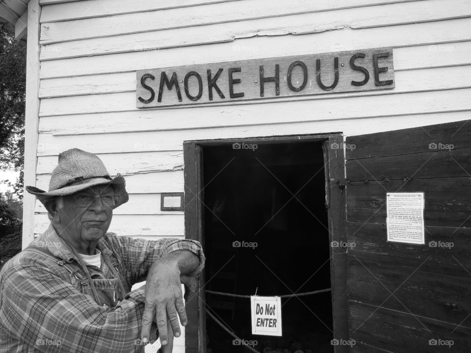 Jim Bob. An old man in front of a country smoke house in rural Virginia, in black & white