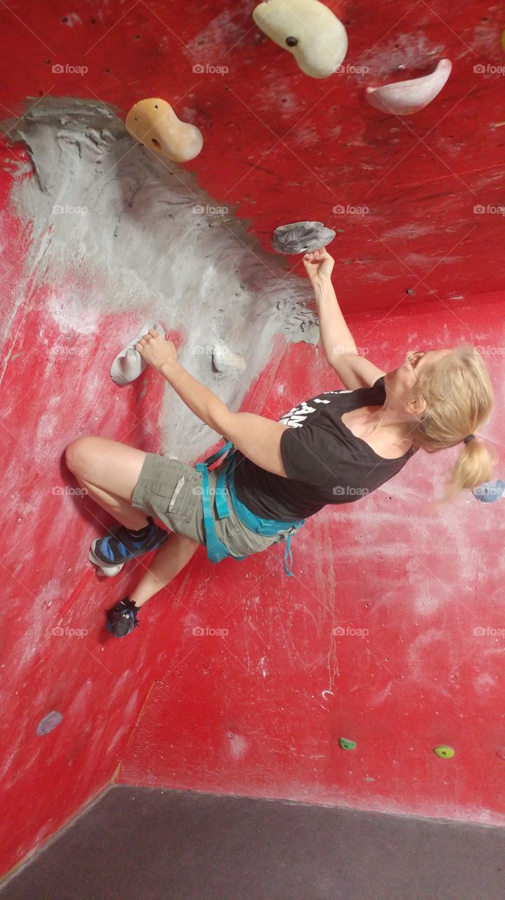 female indoor rock climbing