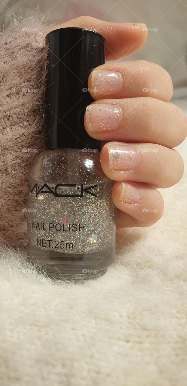 maintenance of your nails, with specific care, with a beautiful shine that highlights the beauty of your hands.  glitter nail polish