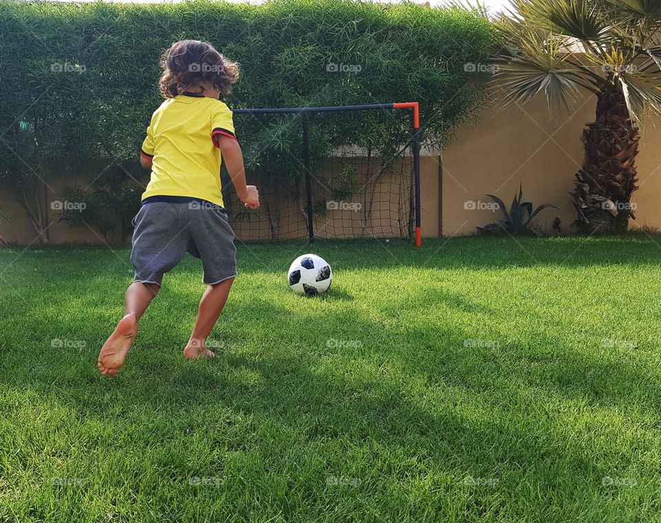 Child playing soccer 