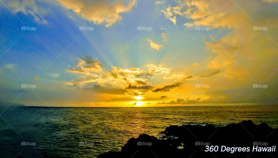 sun rays over the ocean
