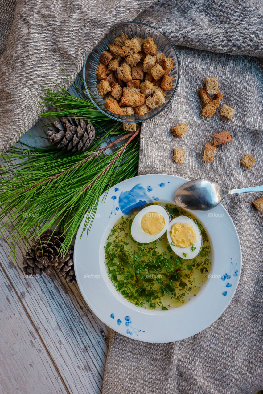 chicken broth with egg and croutons