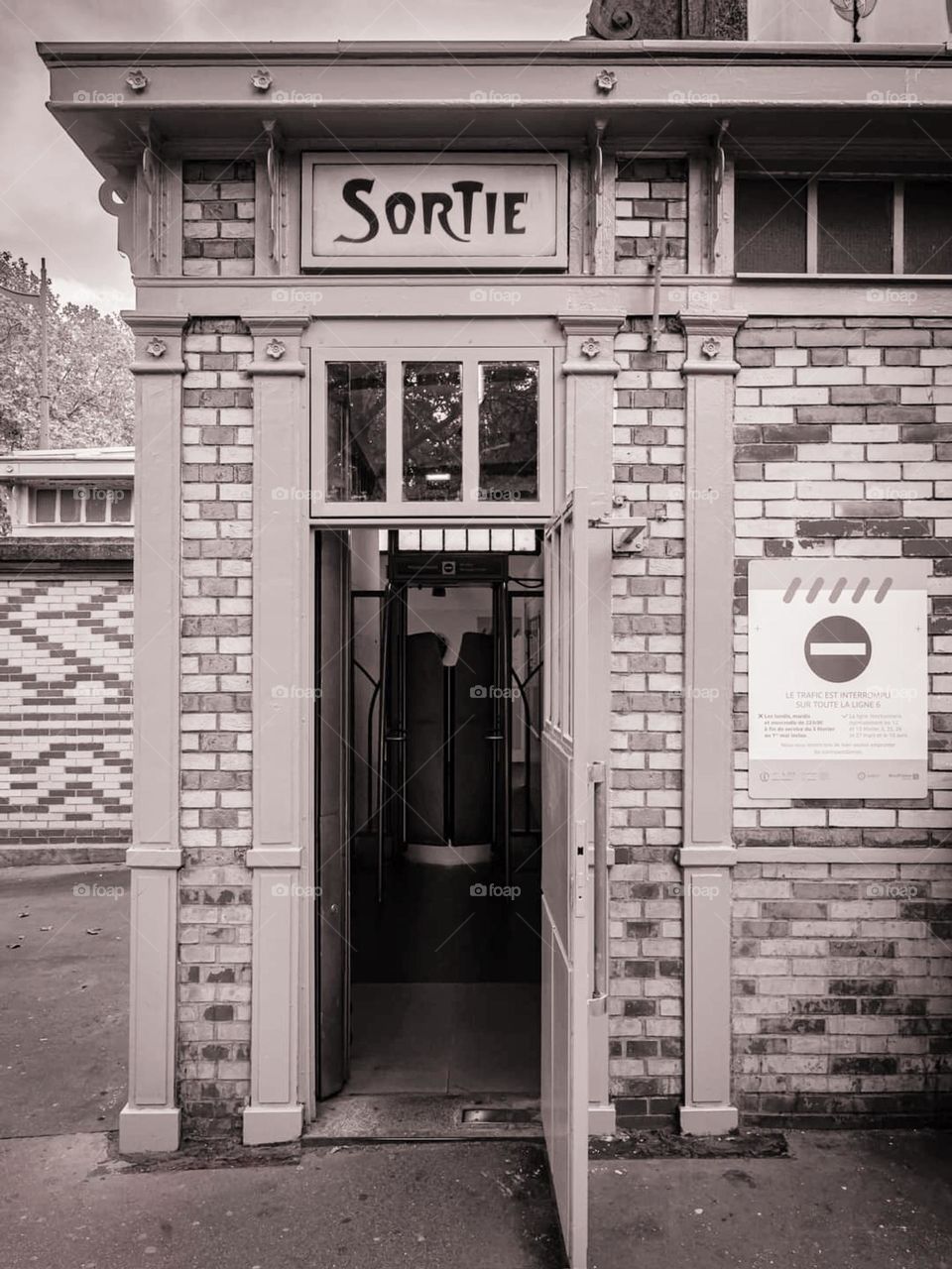 Vintage sepia shot of Metropolitan Glacière station's exit in Paris made of bricks