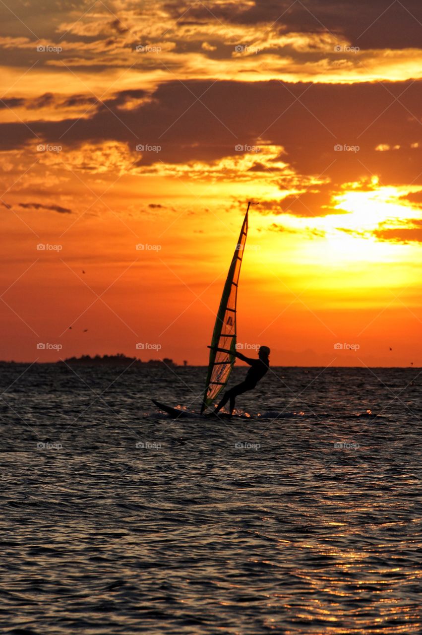 Windsurfing in sunset