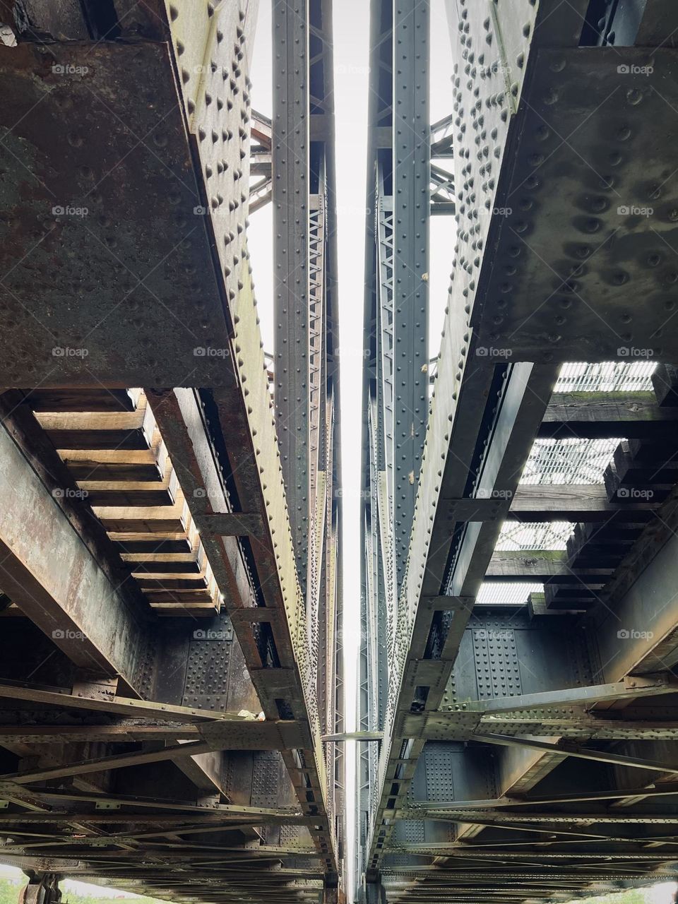 The under side of a train track bridge 